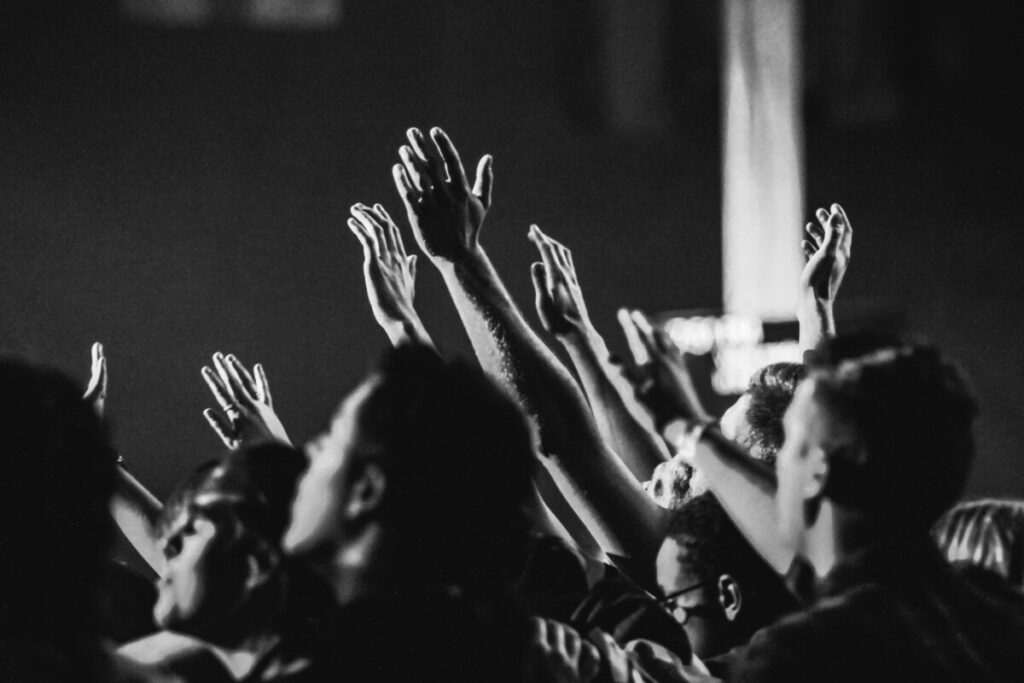 People lifting their hands in Worship