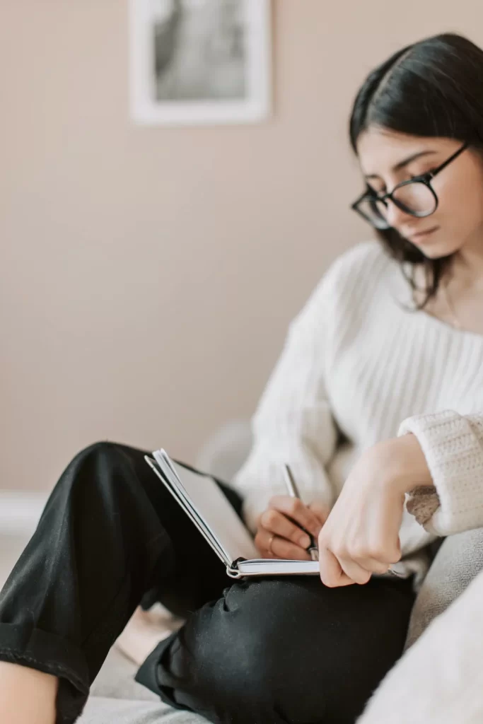 lady writing in her journal 